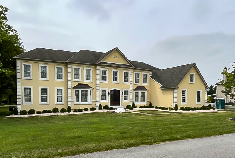 Beautiful stucco home after full exterior remediation and siding restoration by Sperrin Construction in Newtown Square Pennsylvania